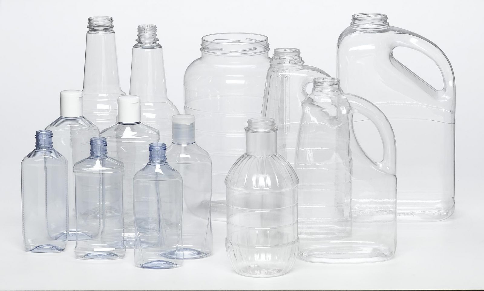 PET various sized clear plastic jugs with screw tops