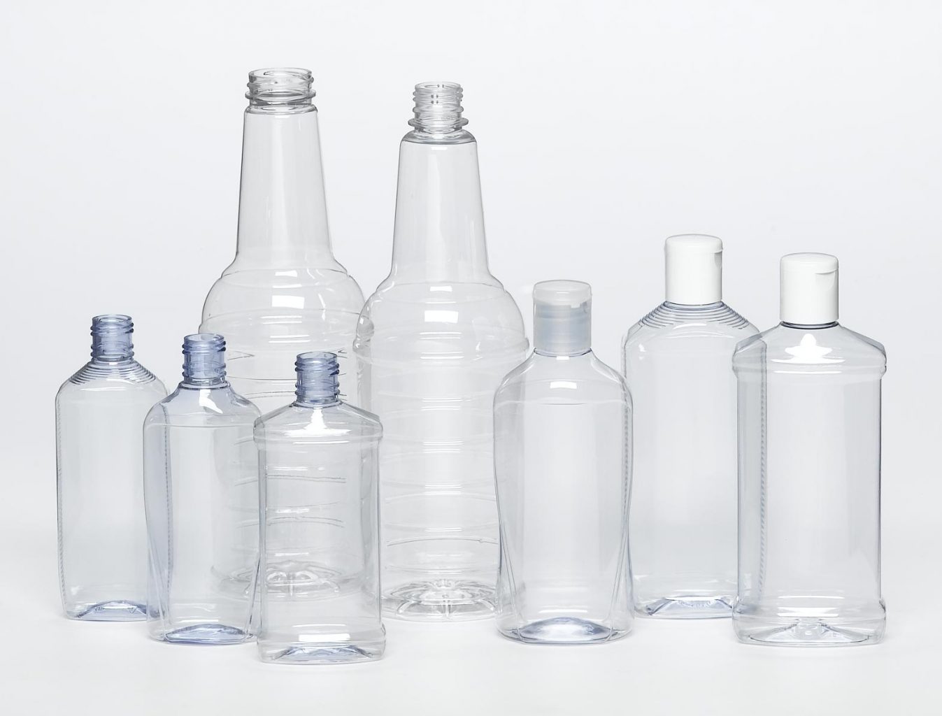 PET clear plastic bottles of various sized with screw tops